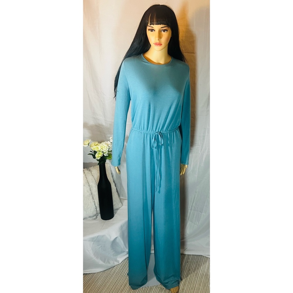 Jumpsuit sleeveless, pleated top in front, side slit pockets, tie front.